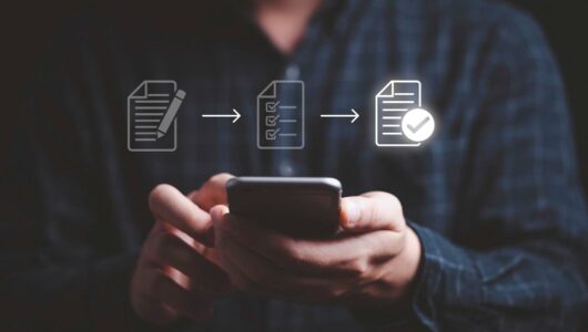 businessman-using-mobile-phone-tick-mark-virtual-document-online-approve-paperless-quality-assurance-erp-management-prepare-check-approve-concept