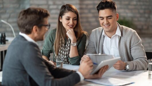 young-happy-couple-having-consultations-with-bank-manager-meeting-office